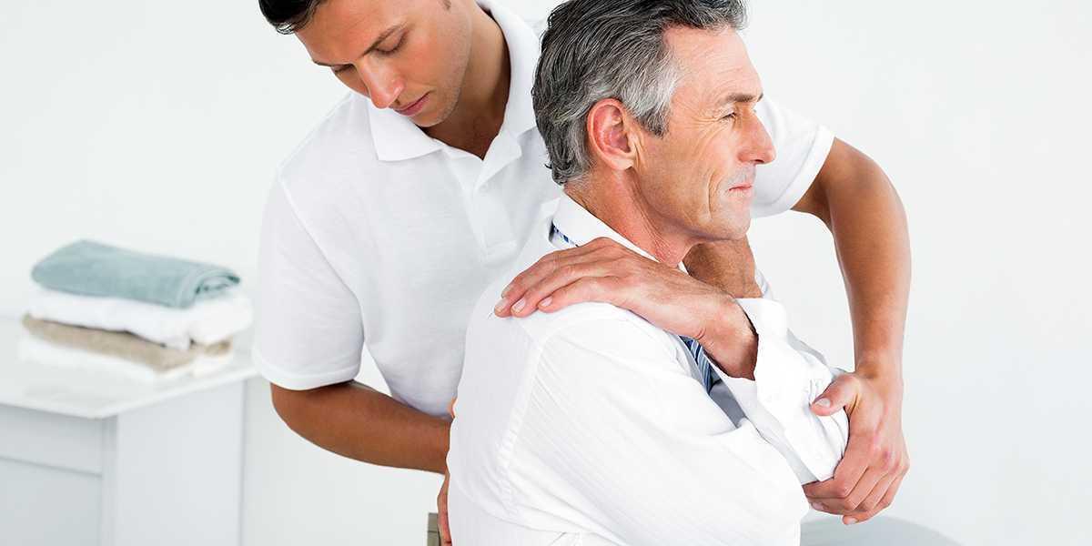 Two men sitting in a psychologist's office during a session of therapy near TruSpine in San Francisco, CA