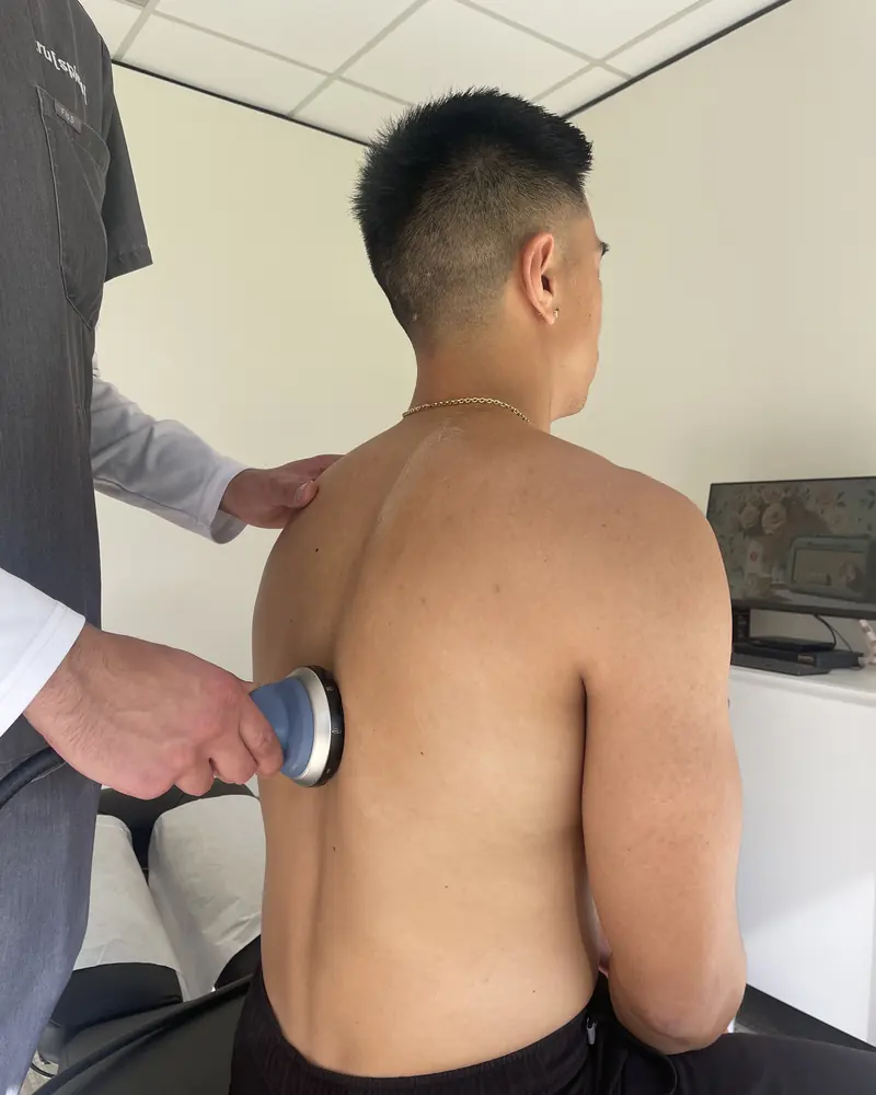 Focused shockwave therapy on the upper back at Truspine San Francisco