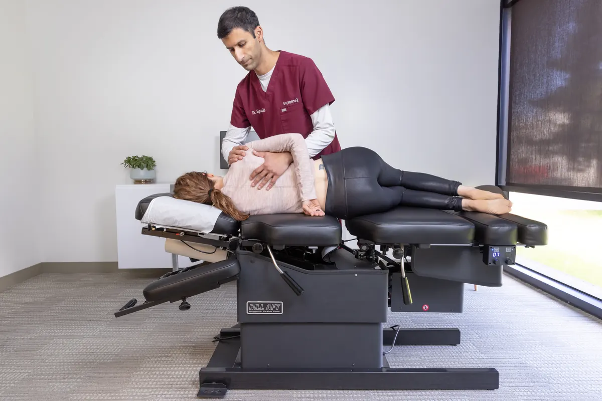 Dr. Supreet Shah performing a side-lying low back (lumbar) chiropractic adjustment in San Francisco