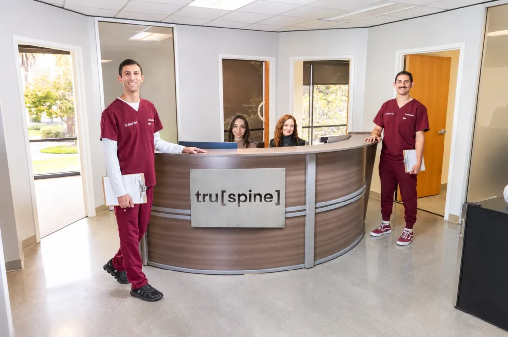 TruSpine chiropractors at the front desk of their San Francisco chiropractic clinic at 50 Francisco Street